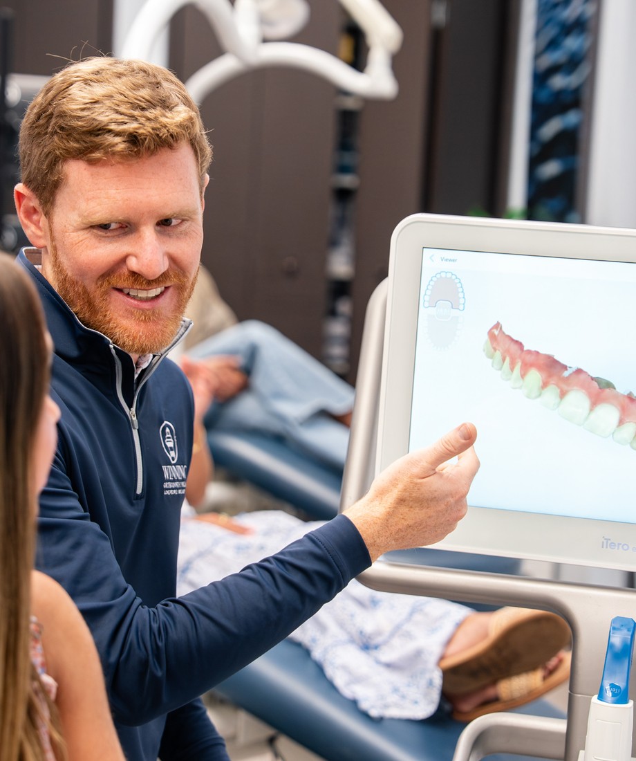 Doctor showing a patient their digital scan on screen