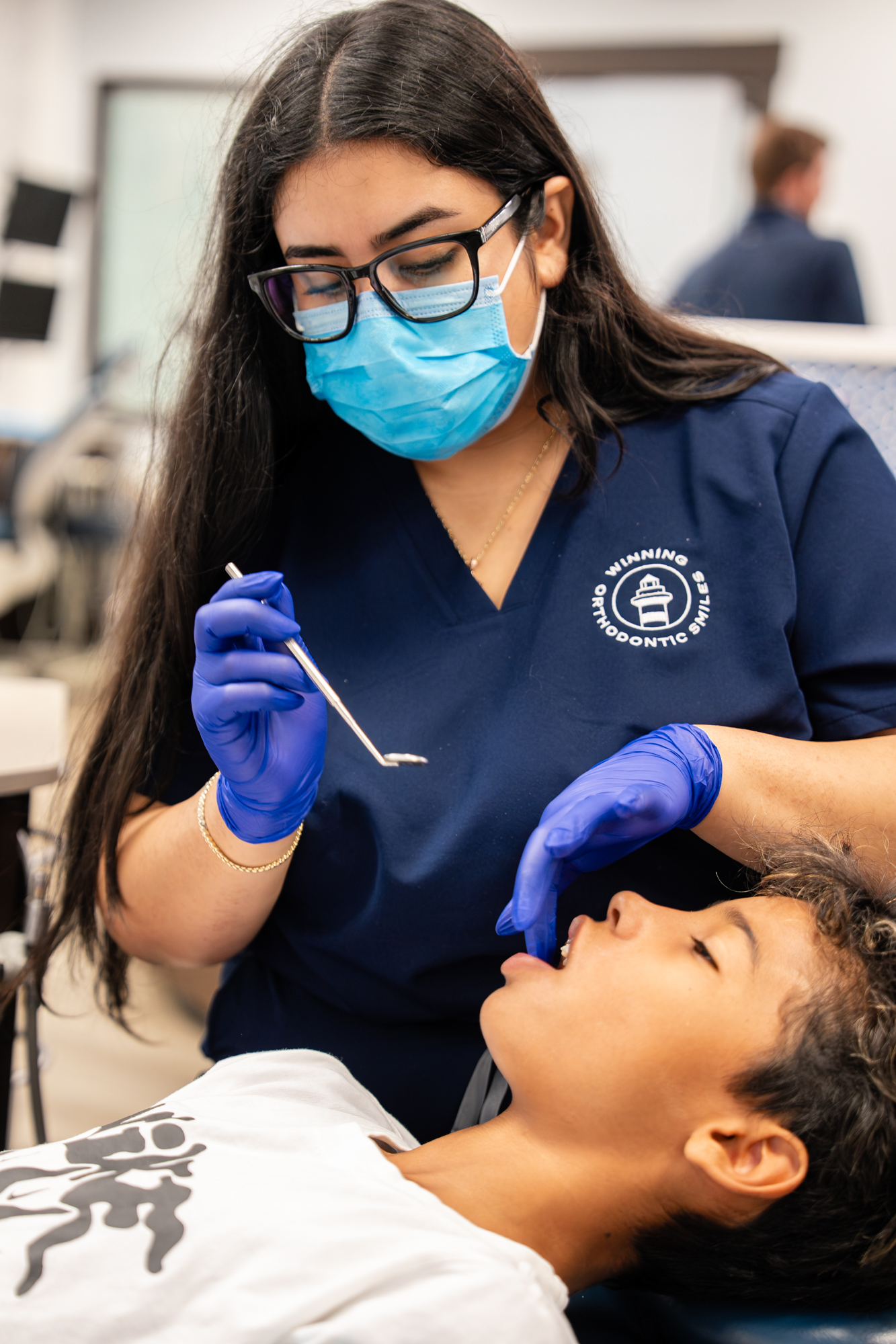 Orthodontic assistant checking a young patient's braces at the Hilton Head Island office