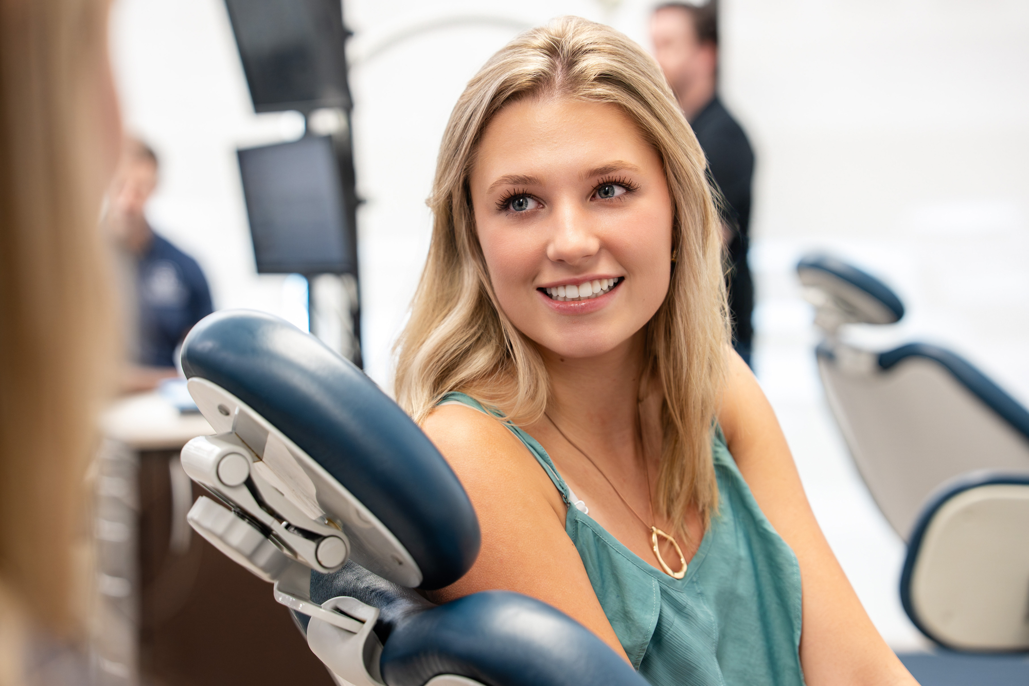Patient smiling in the treatment bay at the Winning Orthodontic Smiles office