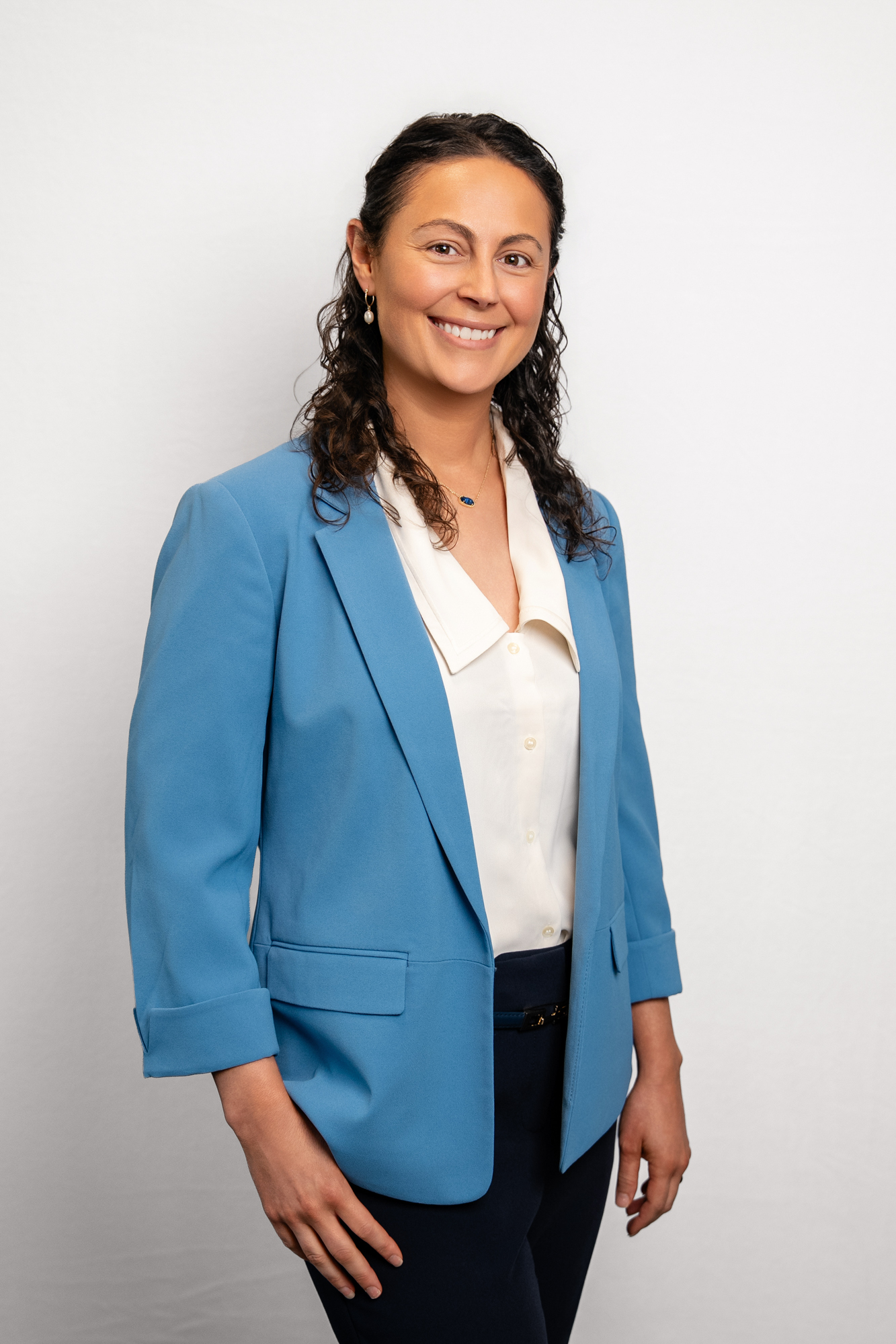 Dr. Katie Solomon, orthodontist at Winning Orthodontic Smiles, in a blue blazer