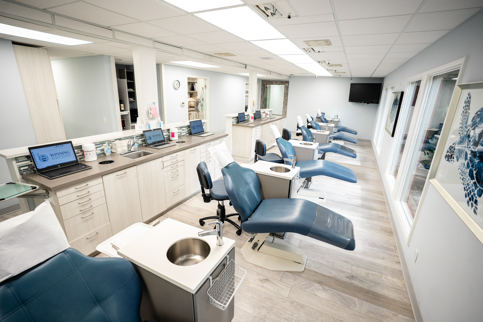 Bright orthodontic treatment bay with patient chairs at Winning Orthodontic Smiles in Beaufort